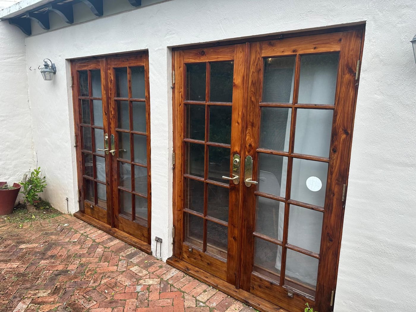 Two sets of cedar French doors after staining